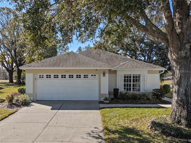 ranch-style house featuring a garage