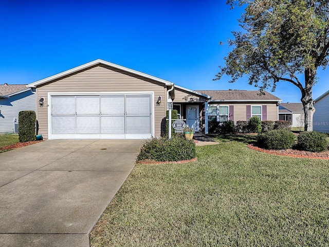 ranch-style house featuring a front lawn and a garage