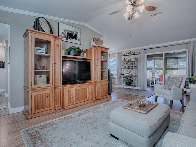 living room featuring ceiling fan, light wood-type flooring, vaulted ceiling, and crown molding