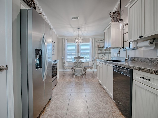 kitchen with sink, crown molding, hanging light fixtures, appliances with stainless steel finishes, and white cabinets