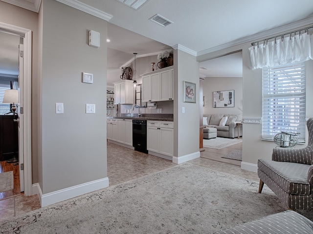 kitchen featuring black dishwasher, white cabinetry, and ornamental molding