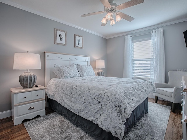 bedroom with ceiling fan, dark wood-type flooring, and ornamental molding