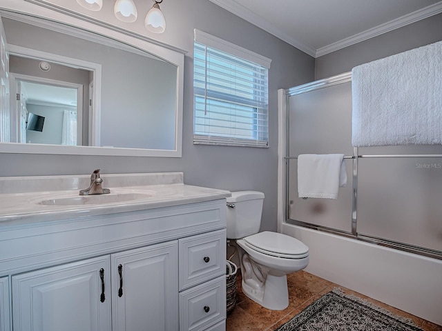 full bathroom with toilet, combined bath / shower with glass door, tile patterned floors, ornamental molding, and vanity