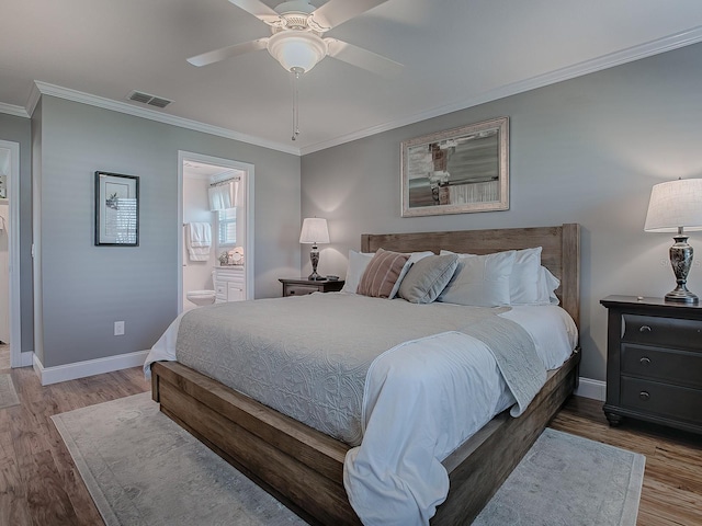 bedroom with ceiling fan, ornamental molding, ensuite bathroom, and hardwood / wood-style flooring