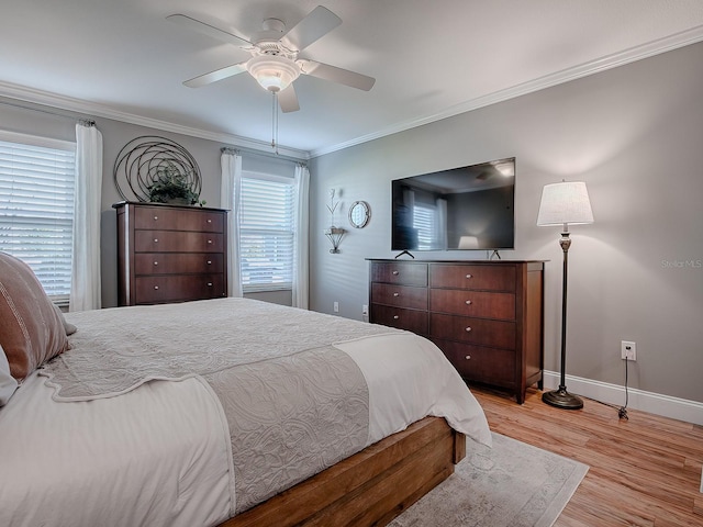 bedroom with ceiling fan, light hardwood / wood-style flooring, and ornamental molding