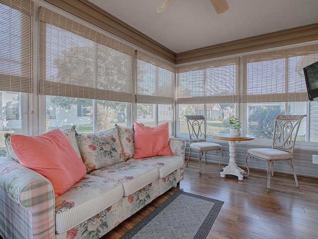 sunroom / solarium featuring ceiling fan