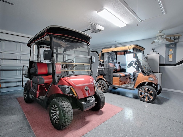 garage with a garage door opener and ceiling fan