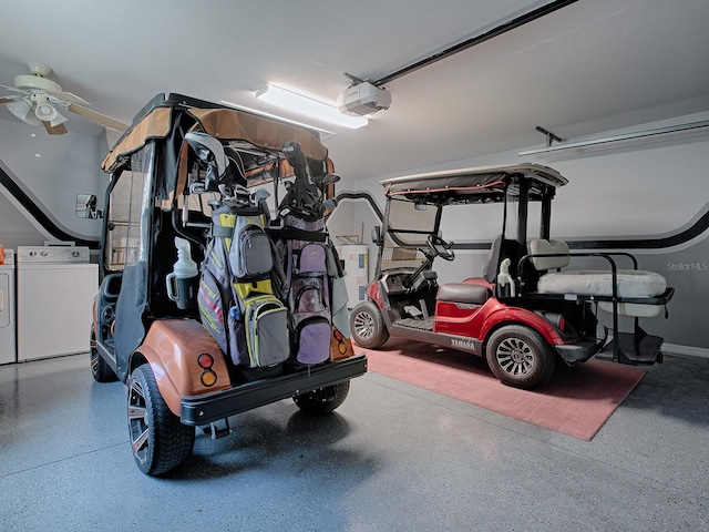 garage featuring washer and clothes dryer and a garage door opener