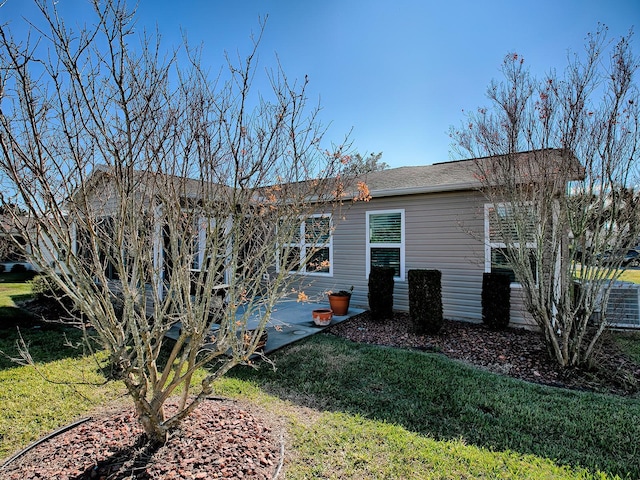 rear view of house with a lawn