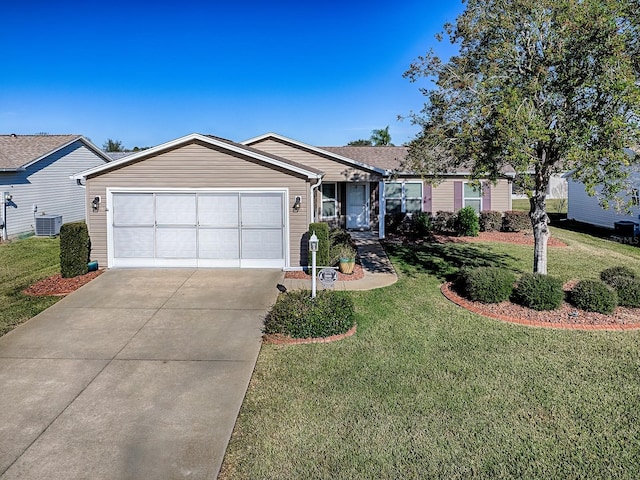 ranch-style house with a garage, a front yard, and central AC