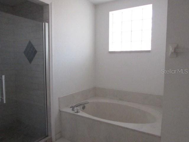 bathroom with independent shower and bath