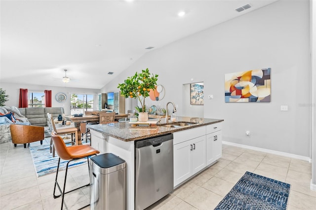 13557 Willow Bluestar Loop, Riverview, FL 33579 - kitchen with stone counters, a sink, stainless steel dishwasher, lofted ceiling, and visible vents