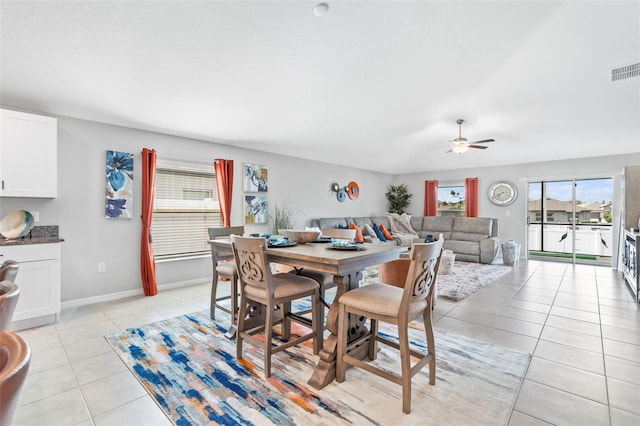 13557 Willow Bluestar Loop, Riverview, FL 33579 - dining space featuring light tile patterned flooring, baseboards, visible vents, and a ceiling fan