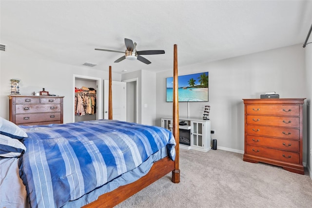 13557 Willow Bluestar Loop, Riverview, FL 33579 - carpeted bedroom featuring a closet, ceiling fan, visible vents, and a spacious closet
