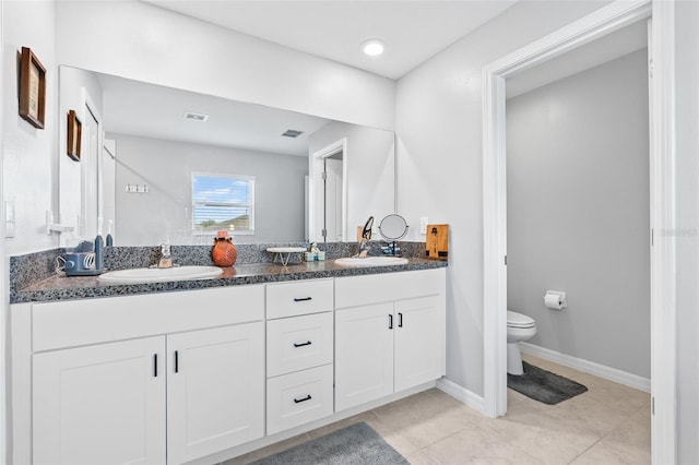 13557 Willow Bluestar Loop, Riverview, FL 33579 - full bathroom with baseboards, double vanity, a sink, and toilet