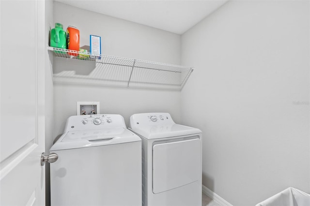 13557 Willow Bluestar Loop, Riverview, FL 33579 - washroom with baseboards, washer and dryer, and laundry area