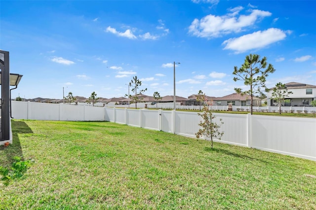 13557 Willow Bluestar Loop, Riverview, FL 33579 - view of yard with a fenced backyard and a residential view