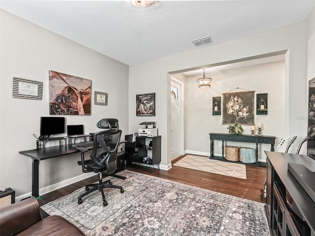 office with dark hardwood / wood-style flooring