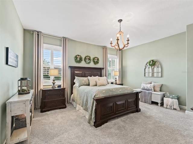 bedroom featuring a notable chandelier and light colored carpet