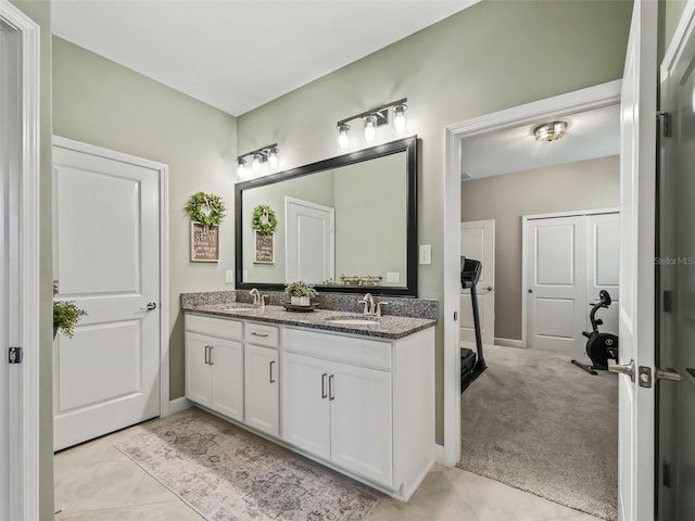 bathroom featuring tile patterned flooring and vanity