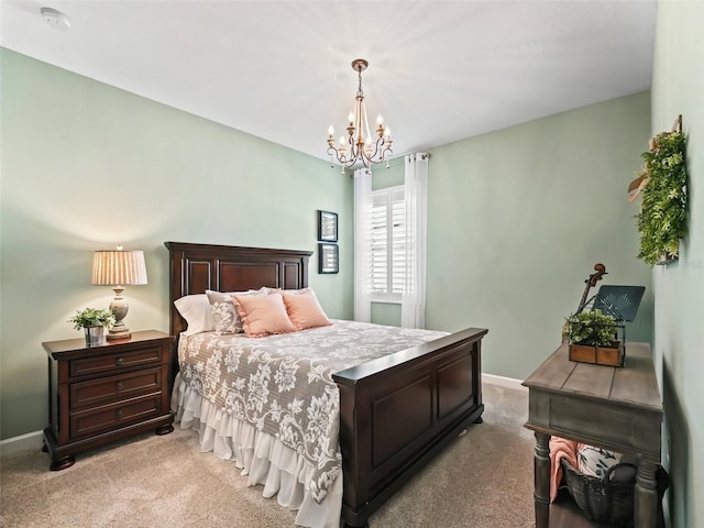 bedroom featuring an inviting chandelier and light colored carpet