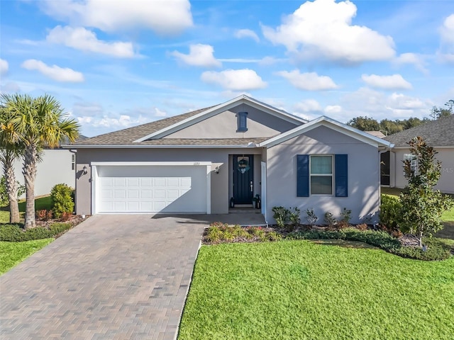 single story home with a garage and a front yard