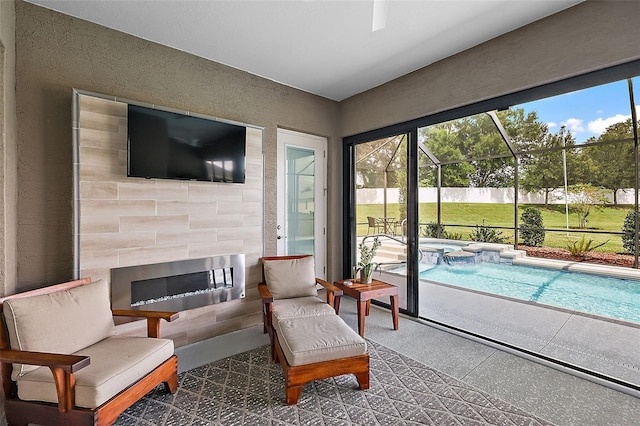 sunroom featuring a swimming pool