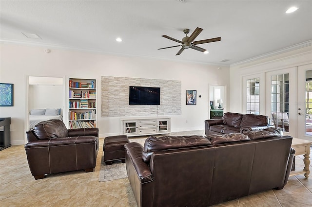 living room featuring french doors, built in features, ceiling fan, light tile patterned floors, and crown molding