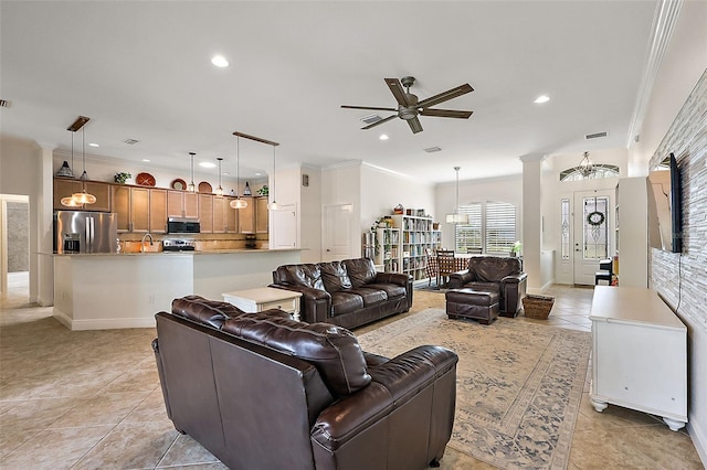 living room with ceiling fan, light tile patterned floors, and ornamental molding