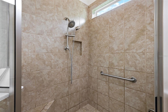 details with a tile shower