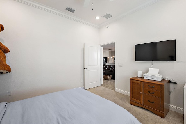 carpeted bedroom featuring ceiling fan and ornamental molding