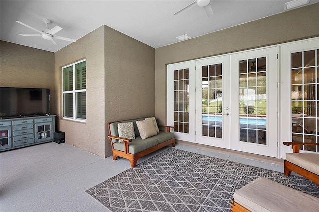 view of patio featuring ceiling fan and french doors