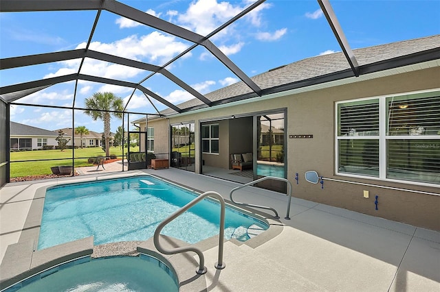 view of pool featuring glass enclosure, a patio area, and an in ground hot tub