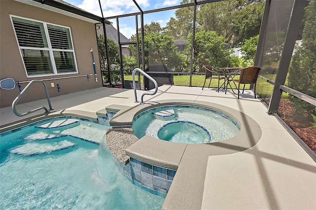 view of swimming pool with a lanai, a patio area, and an in ground hot tub