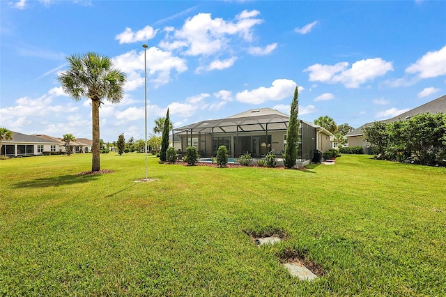 view of yard featuring glass enclosure