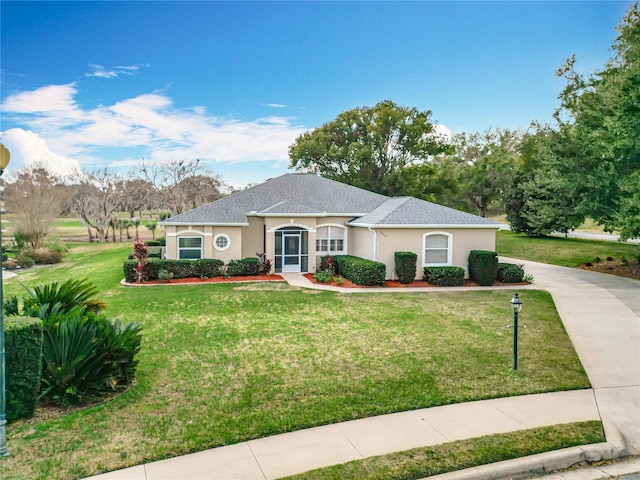 single story home featuring a front lawn