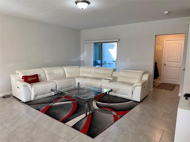 tiled living room with baseboards and a textured ceiling