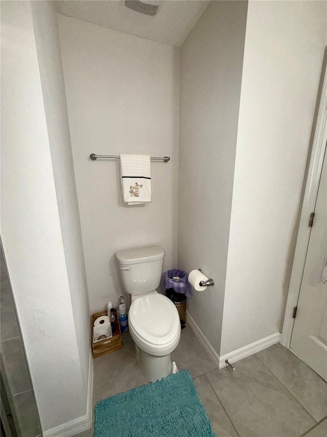 bathroom with tile patterned floors and toilet