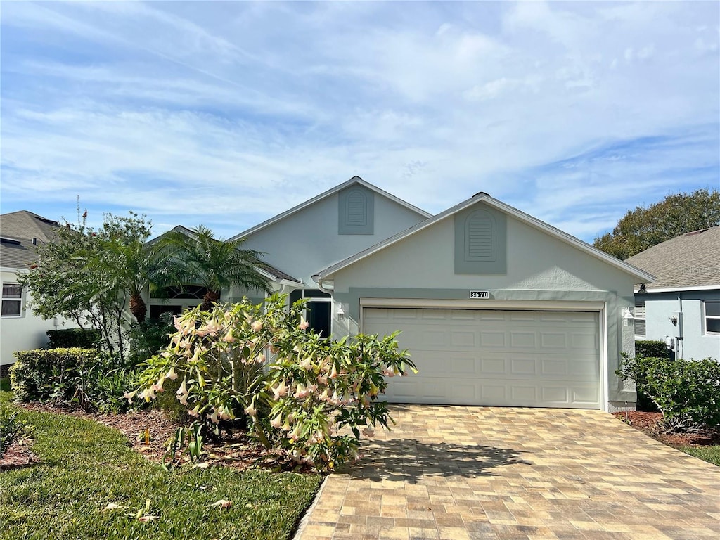 ranch-style house featuring a garage