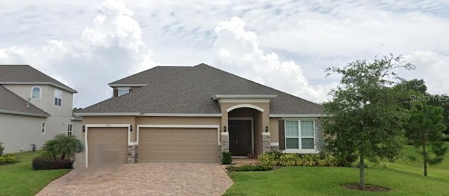 view of front facade with a front lawn and a garage