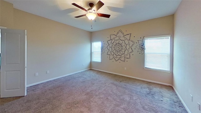 unfurnished room featuring light carpet and ceiling fan