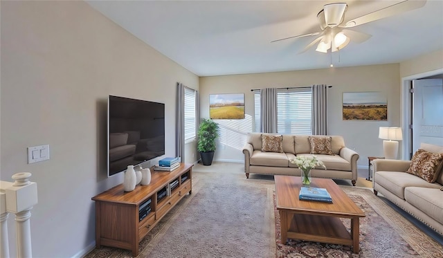 carpeted living room featuring ceiling fan