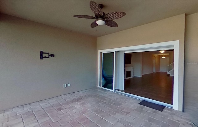 view of patio with ceiling fan