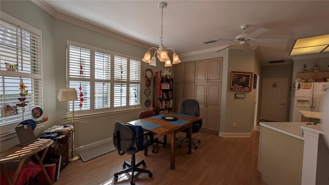 office area featuring light hardwood / wood-style floors, a textured ceiling, ornamental molding, and ceiling fan with notable chandelier