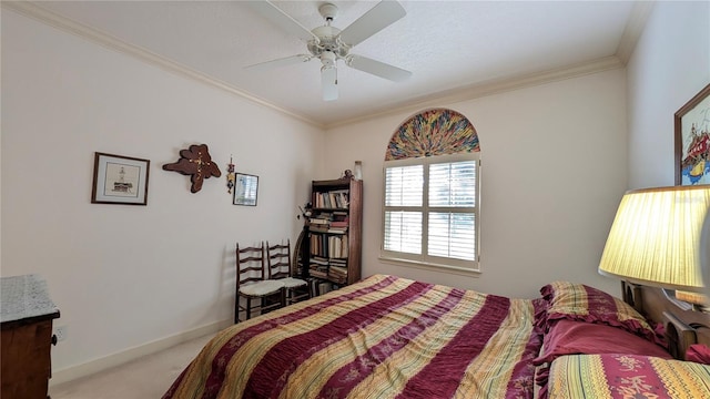 bedroom featuring crown molding, carpet floors, and ceiling fan