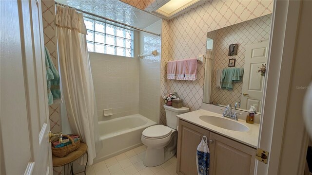 full bathroom with toilet, tile patterned flooring, shower / bathtub combination with curtain, and vanity