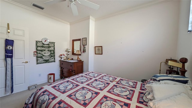 carpeted bedroom with ceiling fan, ornamental molding, and a textured ceiling