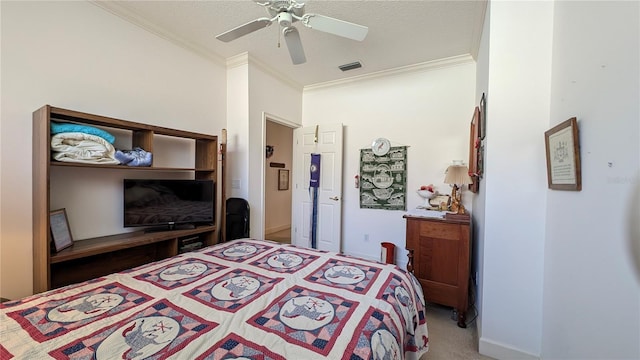 carpeted bedroom with ceiling fan, a textured ceiling, and ornamental molding