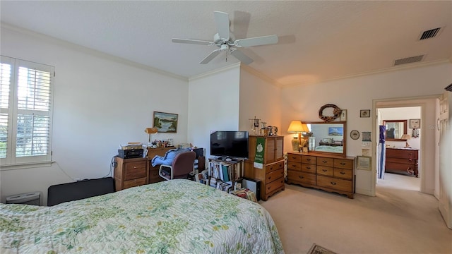 carpeted bedroom featuring ceiling fan and crown molding