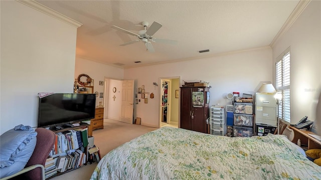 carpeted bedroom featuring crown molding, a textured ceiling, and ceiling fan